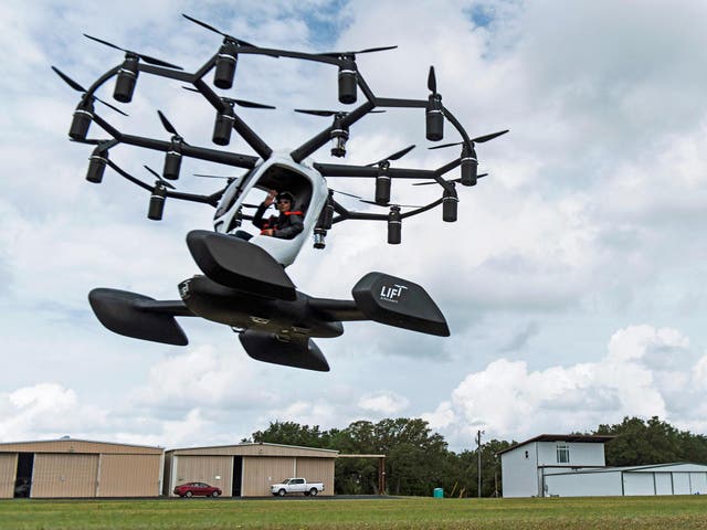 Chief engineer of LIFT aircraft Balazs Kerulo demonstrates the company's "Hexa" personal drone craft in Lago Vista, Texas on June 3 2019