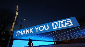 A sign by Wembley Park Tube Station in London that thanks the hardworking NHS staff