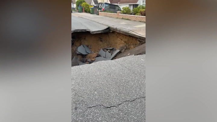 Huge sinkhole opens up and swallows part of south-east London road