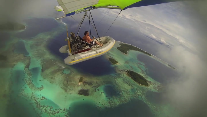 Photographer flies homemade boat plane over South Pacific in breath-taking clip