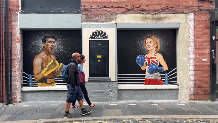 Liz Truss and Rishi Sunak painted as caricature boxers in Belfast mural