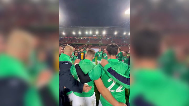 Ireland rugby team huddle after losing against the All Blacks in New Zealand