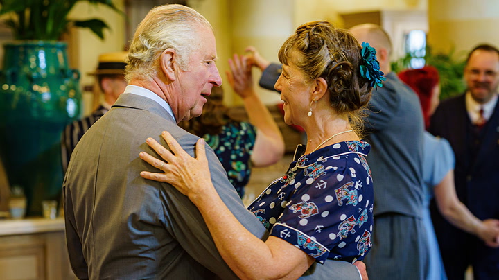 Prince Charles swings into platinum jubilee with surprise appearance at tea dance