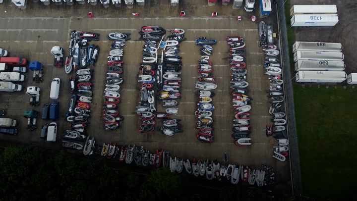 Drone footage shows dozens of migrant dinghies stacked up in Dover