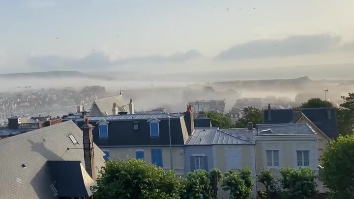 Mini-tornado and sandstorm hit France's seaside in Normandy