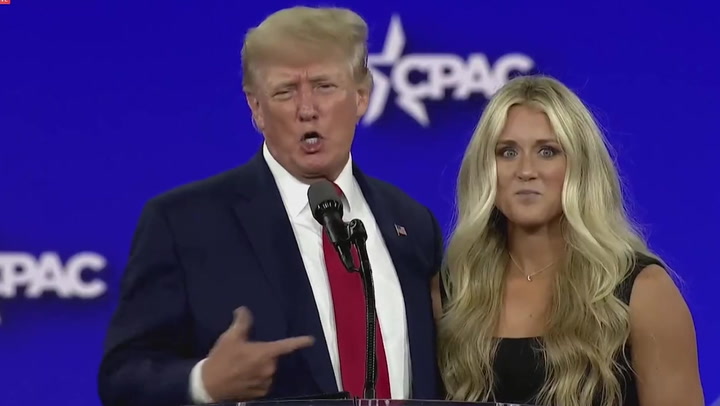 Watch moment Trump welcomes anti-trans swimmer onstage at CPAC