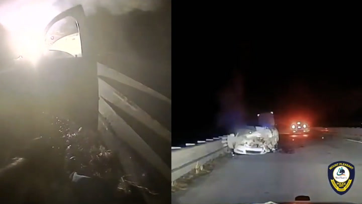 South Carolina police officer pulls woman to safety from burning car