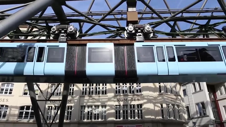 Upside-down train glides through German city