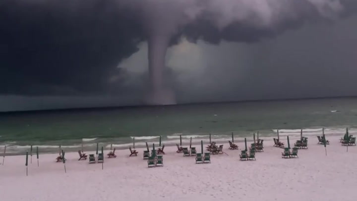 ‘That’s a big ‘un’: Beachgoers marvel at massive waterspout off Florida coast