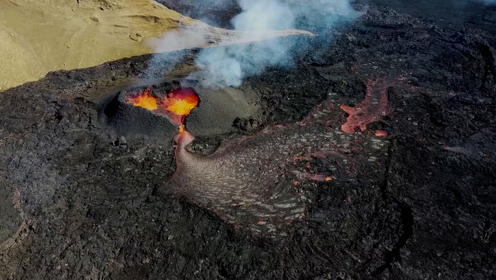 Lava flows from heart-shaped crater on Icelandic volcano