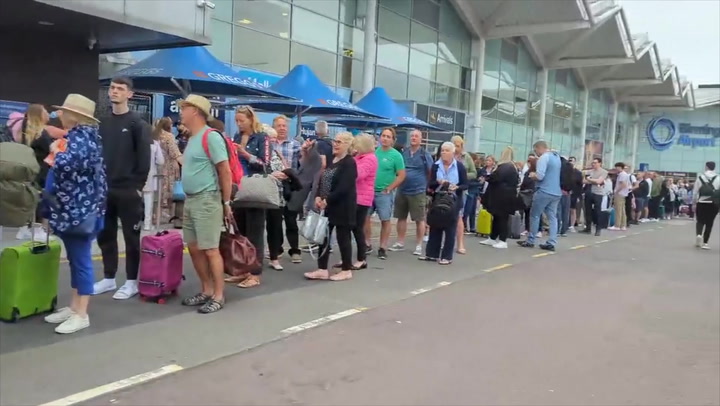 Queues stretch outside of Birmingham airport