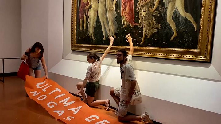 Italian climate activists glue their hands to a Botticelli painting