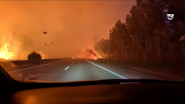Car engulfed in flames and smoke driving through Portugal wildfire in apocalyptic scene