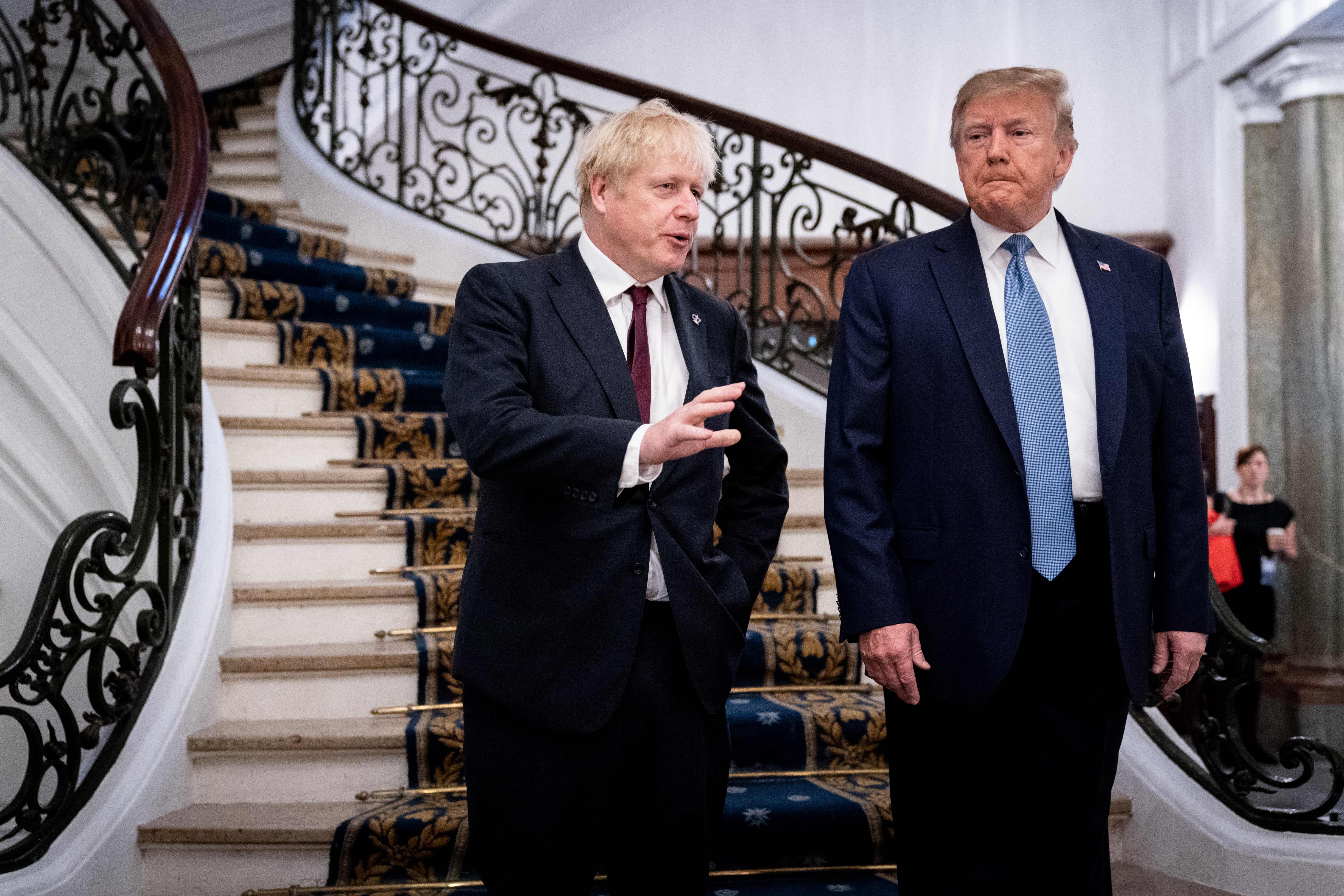 Donald Trump and Boris Johnson speak before a breakfast at the G7 Summit in Biarritz, France