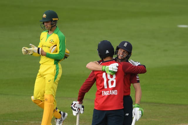 Jos Buttler (right) celebrates with team-mate Moeen Ali