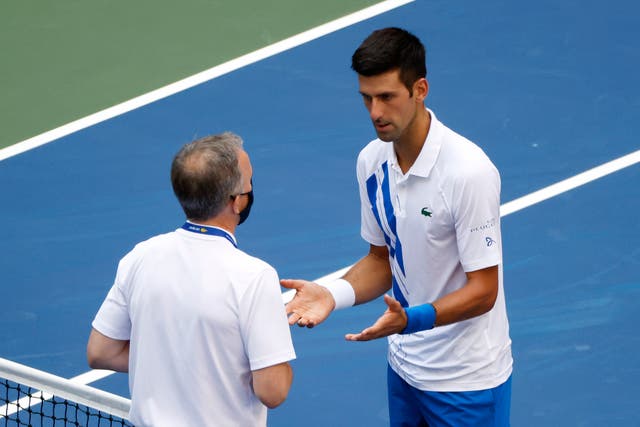 Novak Djokovic talks to Head of Officiating at the ITF Soeren Friemel 