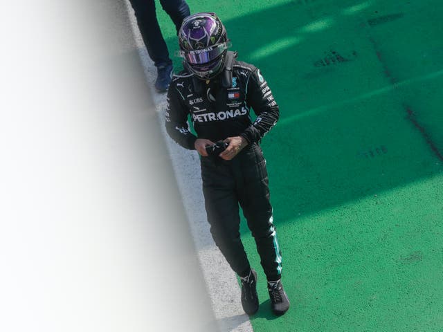 Mercedes driver Lewis Hamilton walks after completing the Italian Formula One Grand Prix