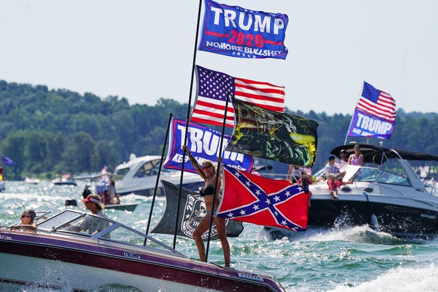 Boats adorned with US and Trump campaign flags are seen on Lake Lanier during a 'Great American Boat Parade' in Georgia