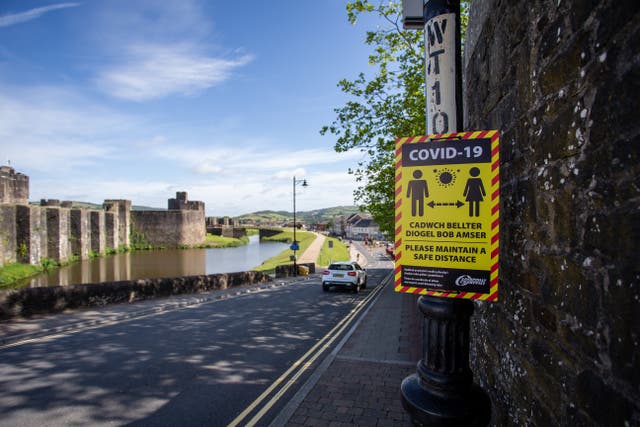 A general view of Non Specific Social distancing signs displayed in the High Street in Caerphilly
