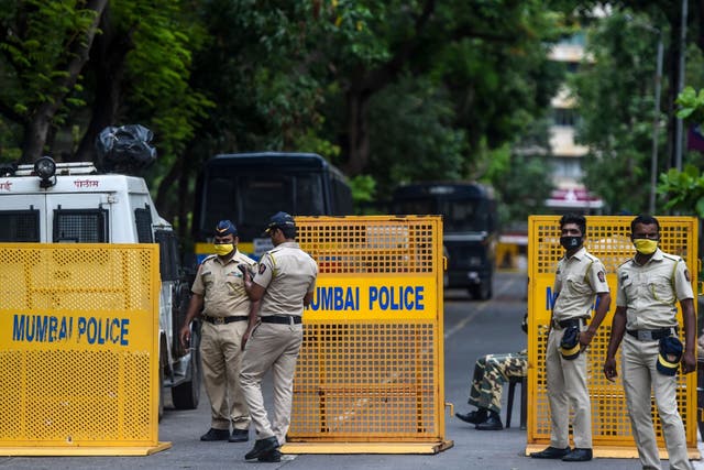 Police stand guard outside the Consulate General of China in Mumbai in June after a violent border brawl that left at least 20 Indian soldiers dead