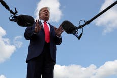 Trump news – live: Explosive allegations of president’s racist comments surface as widower condemns ‘disgusting’ conspiracy theory