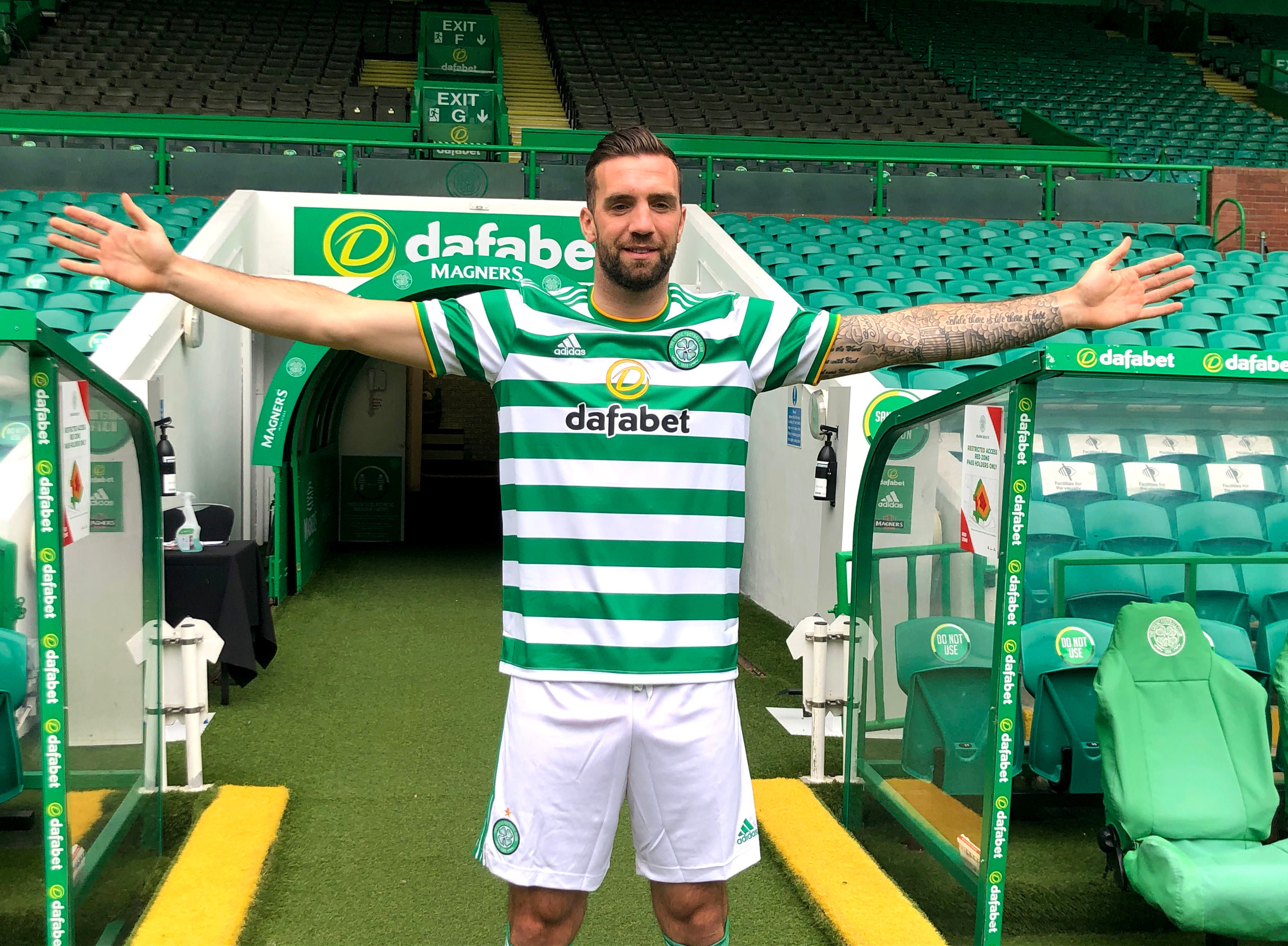 Shane Duffy poses at Celtic Park after moving to Glasgow from Brighton