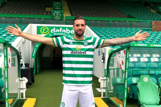 Shane Duffy poses at Celtic Park after moving to Glasgow from Brighton