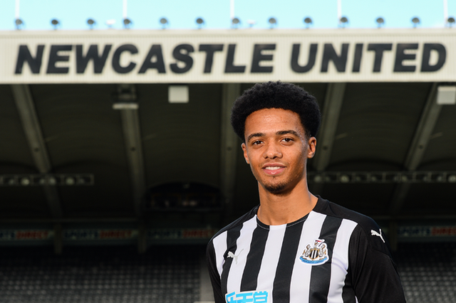 Newcastle United's new signing Jamal Lewis poses in his new kit