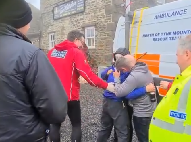 Harry Harvey is embraced by his family after he was reunited with them following four days missing in the Yorkshire Dales
