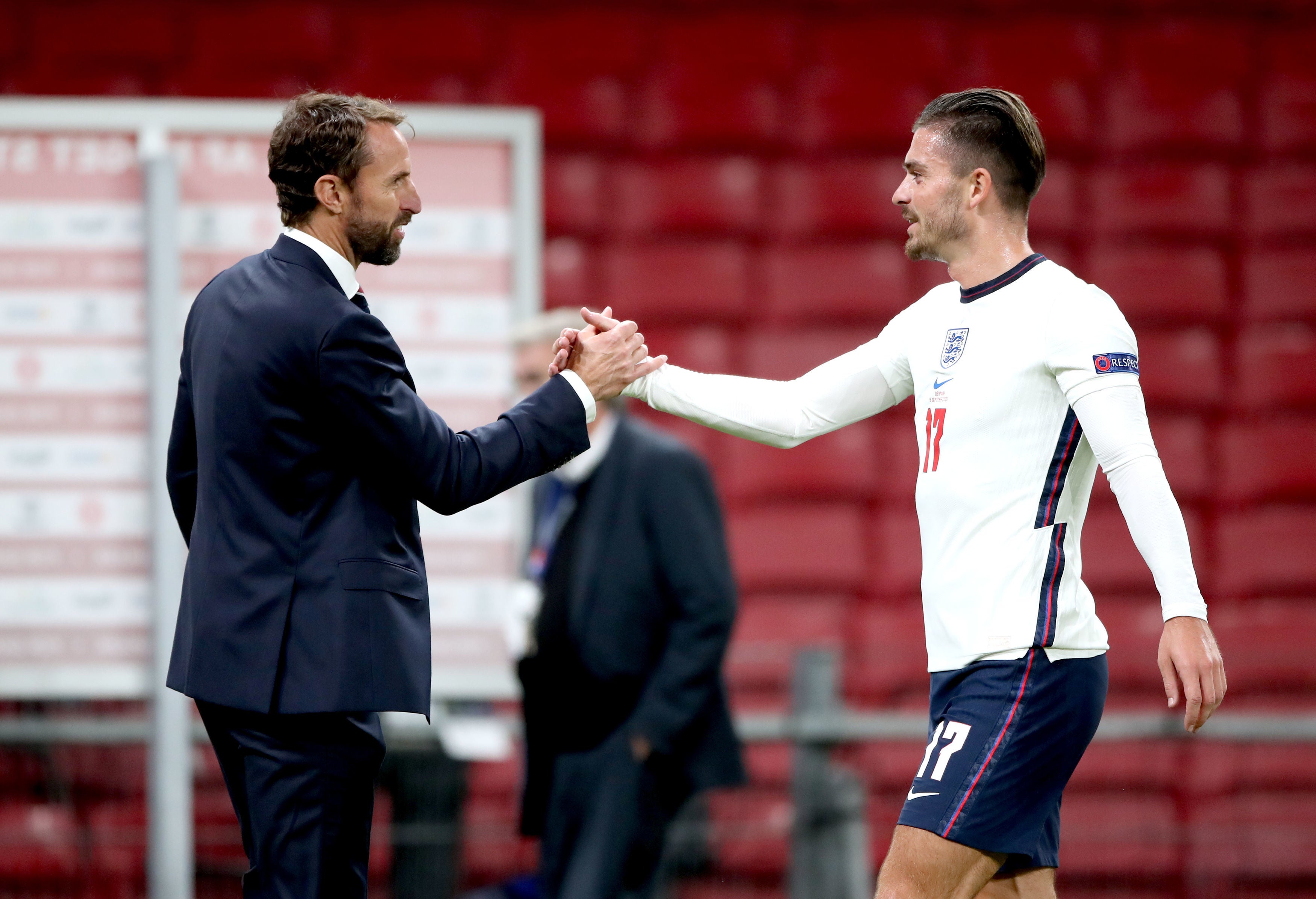 Jack Grealish shakes hands with manager Gareth Southgate