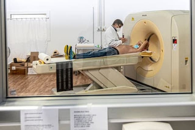 A patient gets a CT scan in Bergamo, Italy