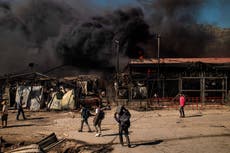 ‘A burning hell’: Thousands of migrants forced to flee after fire rips through Moria camp