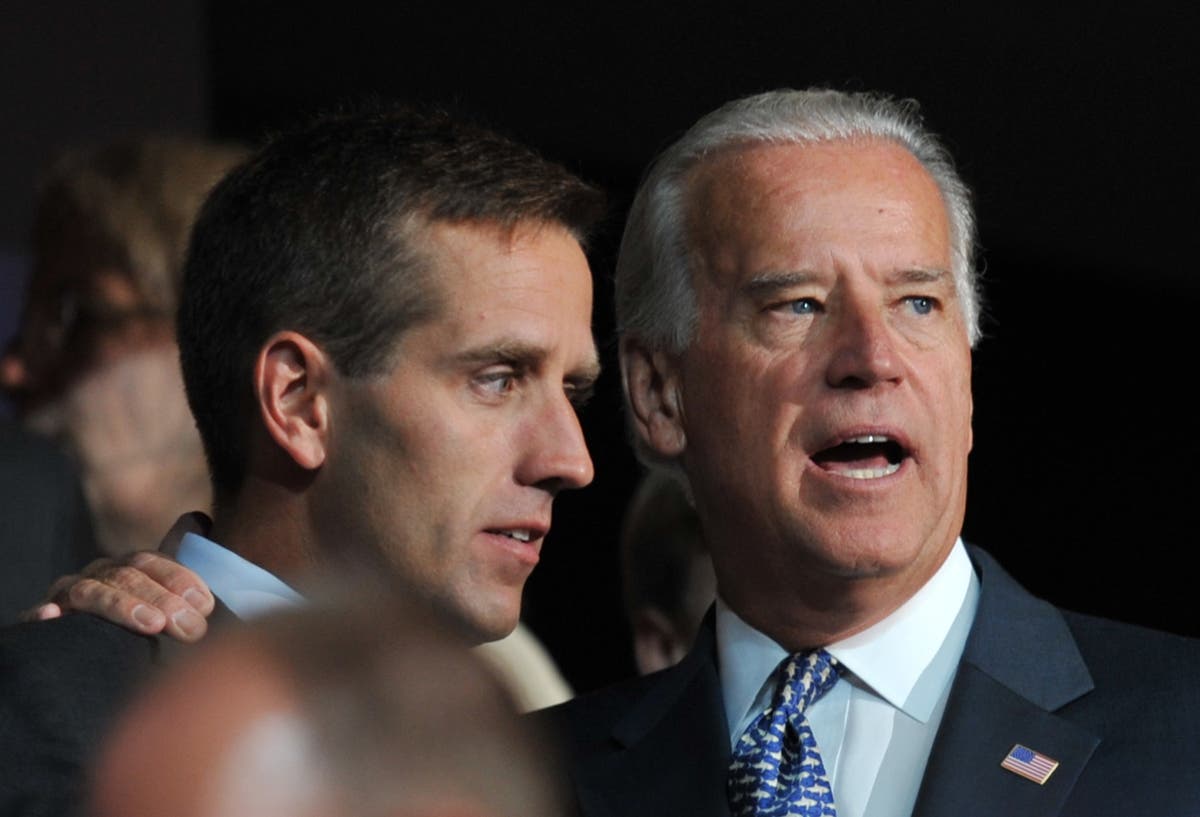 Person in uniform knelt at grave of Beau Biden as his father was ...