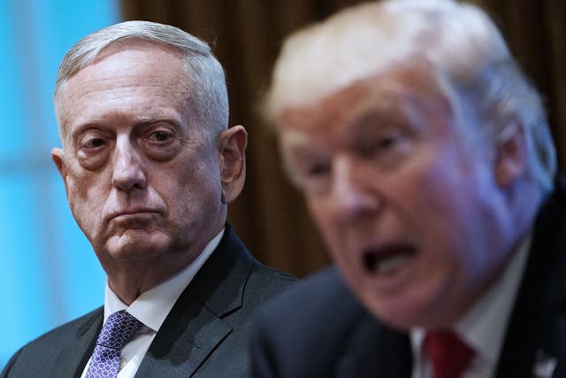 President Donald Trump speaks as defence secretary James Mattis looks on during a meeting with senior military leaders at the White House