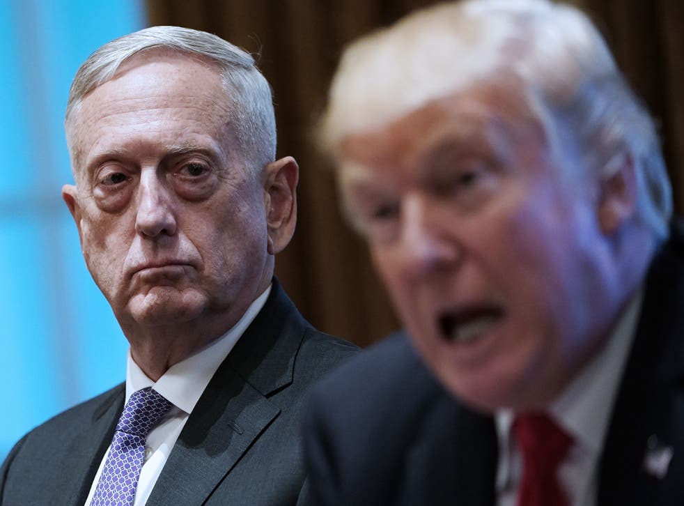 President Donald Trump speaks as defence secretary James Mattis looks on during a meeting with senior military leaders at the White House