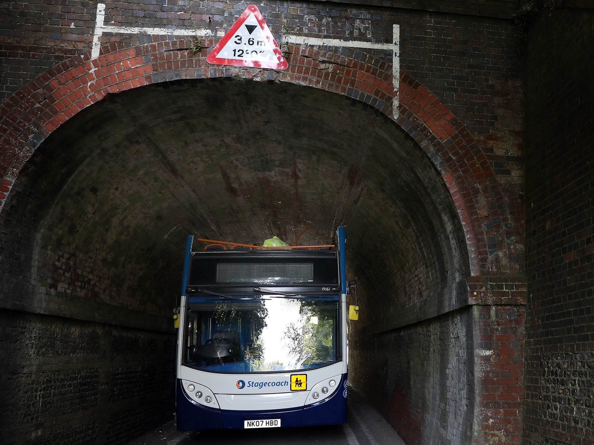 Bus roof was torn off in collision with railway bridge