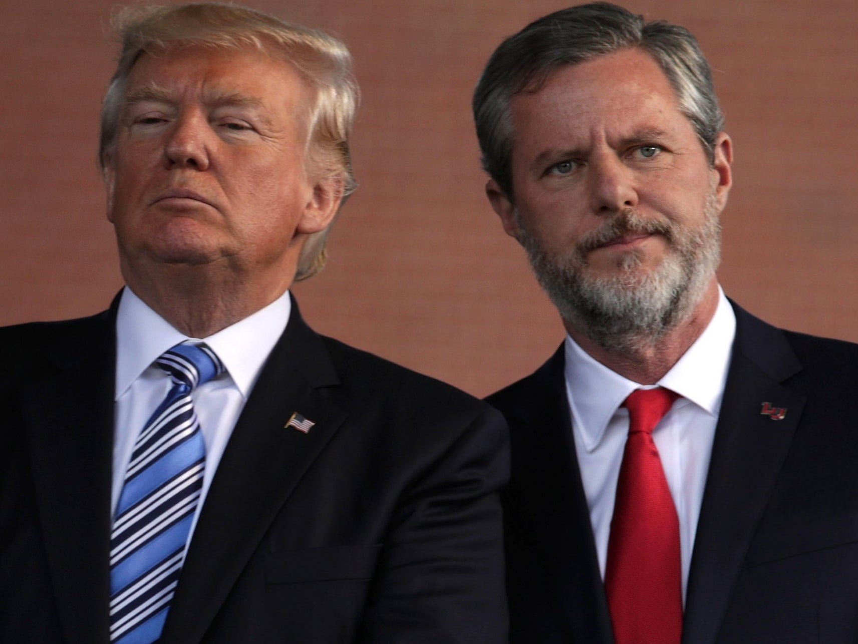Trump and Falwell on stage during a commencement at Liberty University in 2017