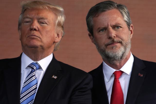 Trump and Falwell on stage during a commencement at Liberty University in 2017