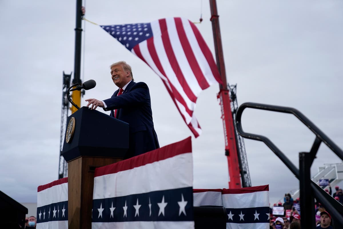 Trump tries to win over key Michigan voters with bleak warnings about a Biden economy in speech praising Kim Jong-un and Putin