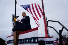 Trump tries to win over key Michigan voters with bleak warnings about a Biden economy in speech praising Kim Jong-un and Putin