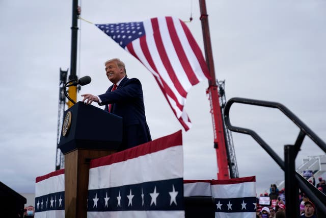 Donald Trump on Thursday warned Michigan voters that a President Joe Biden would be a "sellout" who ships their jobs to China. 