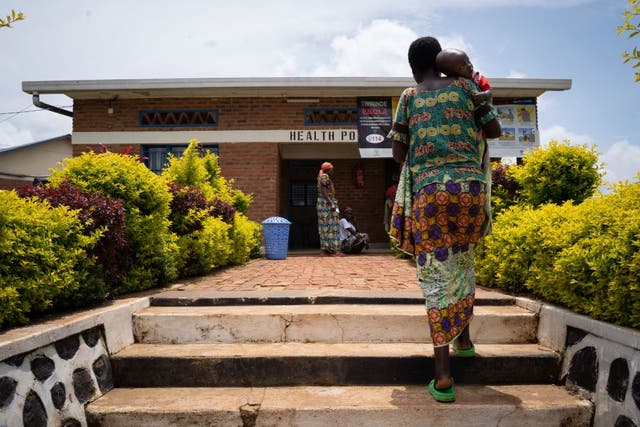 A woman and her child outside a medical centre at Nyarushishi transit center in western Rwanda 