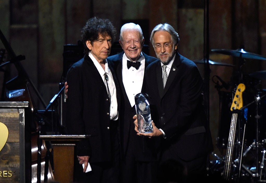 Bob Dylan, former US President Jimmy Carter and National Academy of Recording Arts and Sciences President Neil Portnow appear onstage at the 25th anniversary MusiCares 2015 Person Of The Year Gala on 6 February 2015 in Los Angeles, California