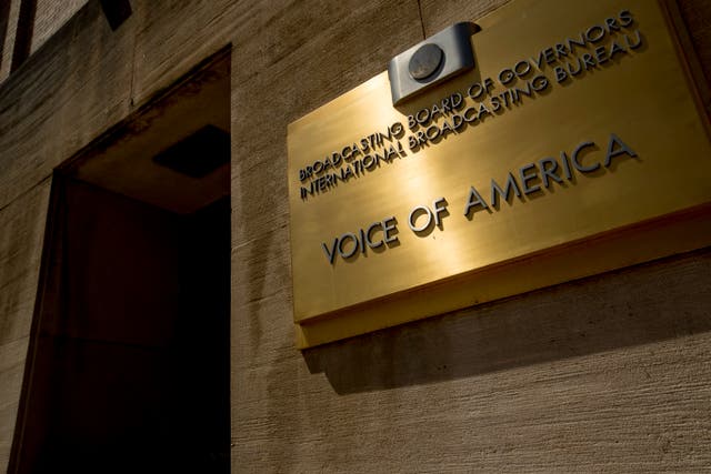 Dozens of Voice of America journalists are protesting Michael Pack's staff purge, threats to visas and accusations that the news outlets he oversees are ripe for espionage.