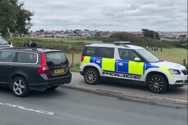The police officer was attacked while helping bailiffs with an eviction from private land in Newquay, Cornwall
