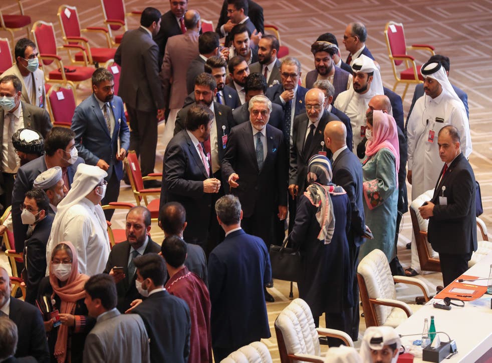 Abdullah Abdullah, chair of Afghanistan's High Council for National Reconciliation, speaks with members of delegations
