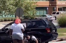 Shocking video shows white police ‘punching black man after taxi carrying him stopped’