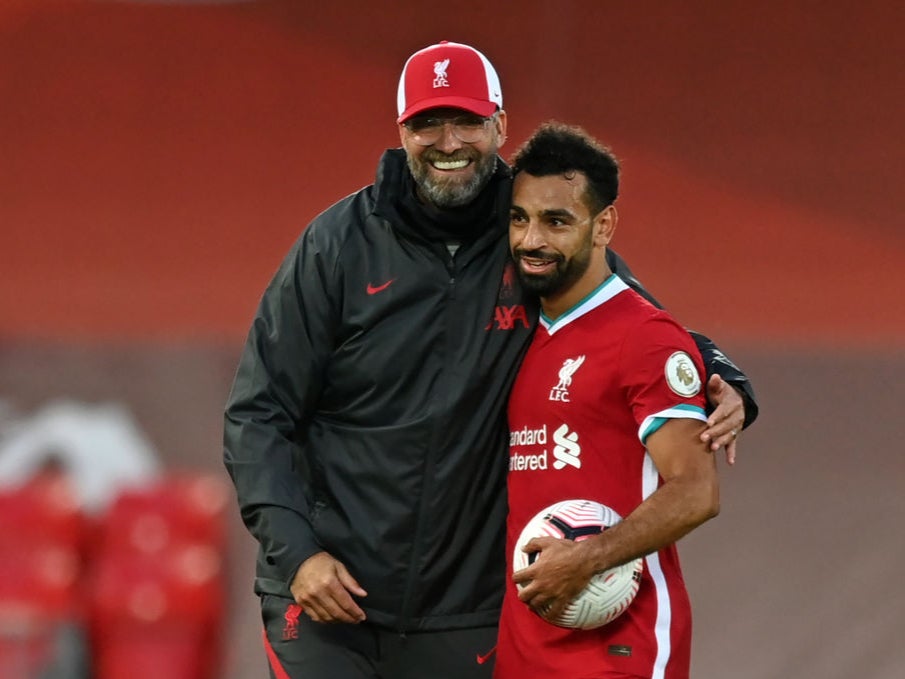Mohamed Salah is congratulated by manager Jurgen Klopp