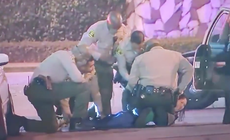 Female journalist pinned to ground and arrested by LAPD while filming police being heckled
