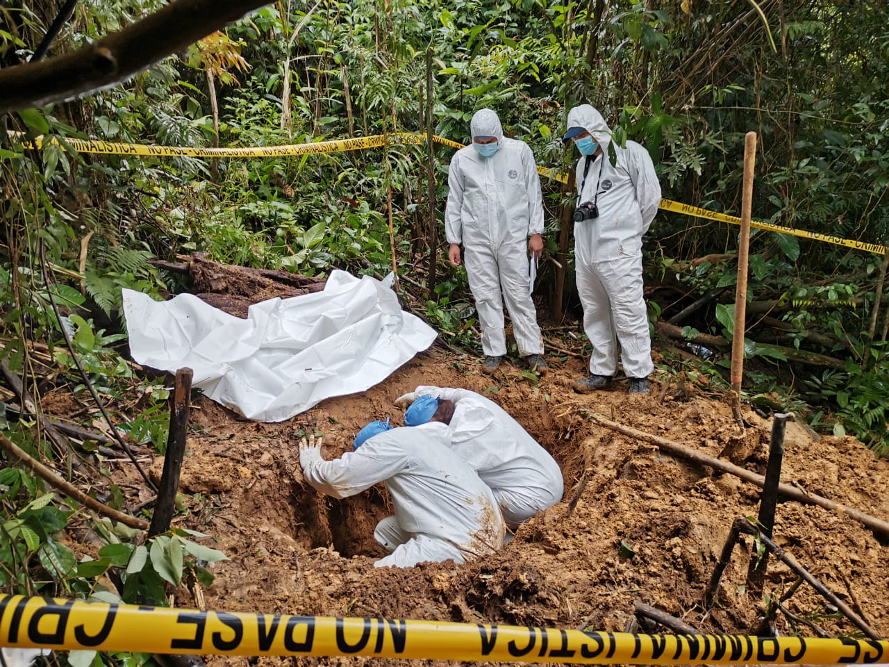 Police exhume a mass grave linked to a religious cult in remote Panama.